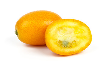 Image showing Whole and sliced kumquat fruits