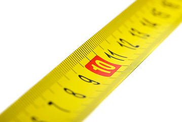 Image showing Close-up shot of yellow metal measurement tape