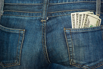 Image showing Jeans rear pocket with $100 banknotes