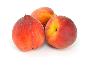 Image showing Three tasty peaches