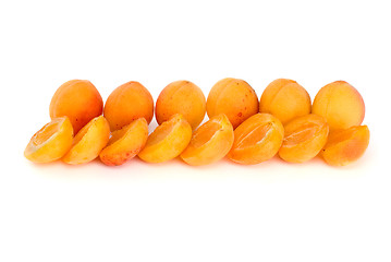 Image showing Few whole apricots and some halves