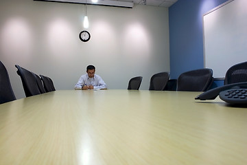 Image showing Signing a Document in a Conference Room