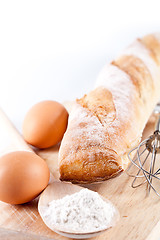 Image showing bread, flour, eggs and kitchen utensil 