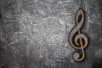 Image showing rusty clef on grunge background