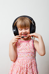 Image showing Little girl with headphones