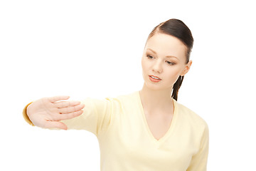 Image showing businesswoman working with something imaginary