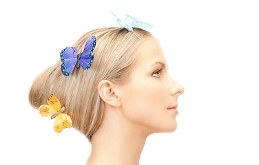 Image showing beautiful woman with butterfly in hair