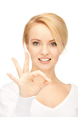 Image showing lovely teenage girl showing ok sign