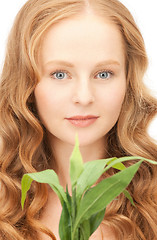 Image showing woman with green sprout