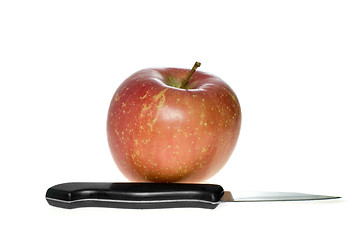 Image showing Red apple and small steel knife