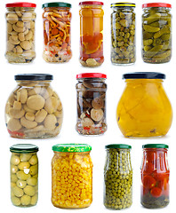 Image showing Set of different berries, mushrooms and vegetables conserved in glass jars