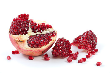 Image showing Half of pomegranate, piece and some berries