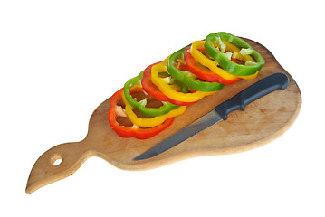 Image showing Cutting board with knife and bell pepper slices