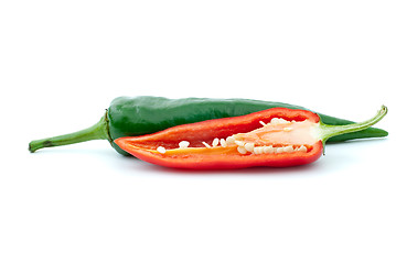 Image showing Green and half of red hot peppers