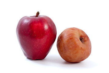 Image showing Fresh red and brown rotten apples