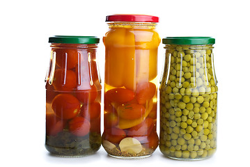 Image showing Three glass jars with marinated vegetables