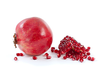 Image showing Whole pomegranate\ piece and some beries