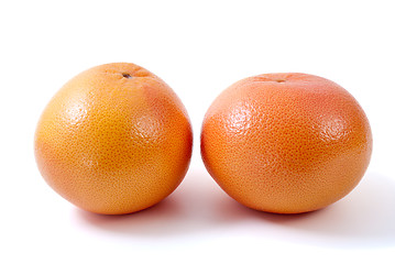 Image showing Two orange grapefruits