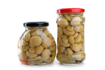 Image showing Two glass jars with marinated champignons