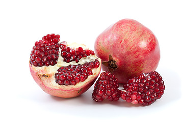 Image showing Whole pomegranate, half and pieces