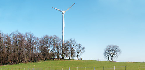 Image showing Countryside landscape with wind turbine