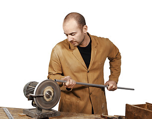 Image showing craftsman work at grinder