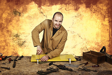 Image showing carpenter at work grunge background