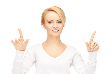 Image showing businesswoman working with something imaginary