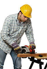 Image showing manual worker and electric saw