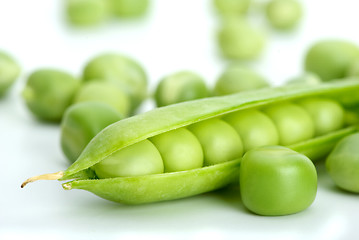 Image showing Macro shot of cracked pod and green peas