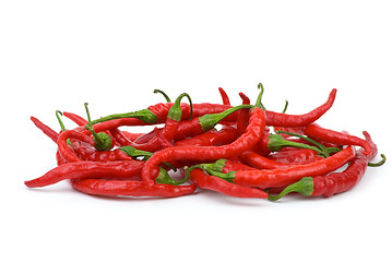 Image showing Pile of long curved red hot chili peppers