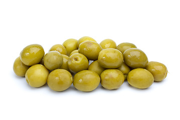 Image showing Some green olives with pits