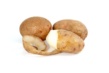 Image showing Potatoes. Whole and half-peeled