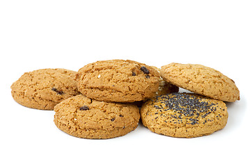 Image showing Few oatmeal cookies (with raisins, sesame and poppy seeds) isolated on the white background