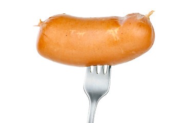 Image showing Sausage on fork isolated on the white background