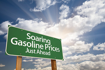 Image showing Soaring Gasoline Prices Green Road Sign and Clouds