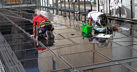 Image showing glass cleaner manual worker