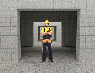 Image showing manual worker in modern building