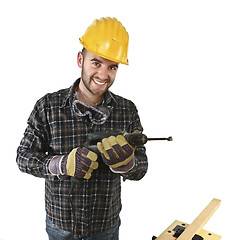 Image showing isolated standing handyman with electric drill 