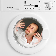 Image showing funny portrait of man inside washing machine