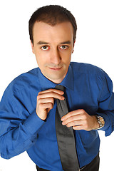 Image showing businessman adjust tie