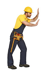 Image showing handyman in push position suitable for composition