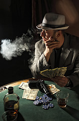 Image showing gangster smoking and play poker