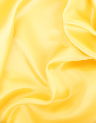 Image showing Smooth elegant golden silk as background 