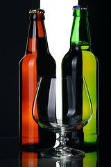 Image showing Bottles of beer from green and brown glass, isolated.