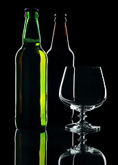 Image showing Bottles of beer, isolated on a black background