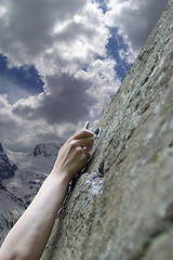 Image showing Climber's hand with quick-draws