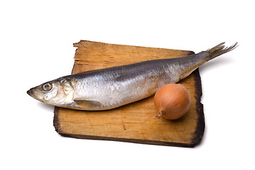 Image showing Herring with onion on old wooden board