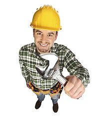 Image showing handyman smile and hold wrench