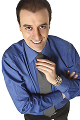 Image showing businessman adjust tie